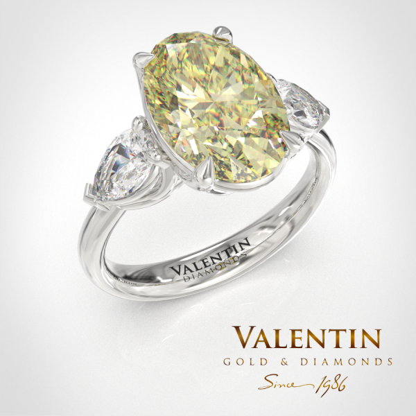 4766 fancy yellow oval and 2 pear diamond ring